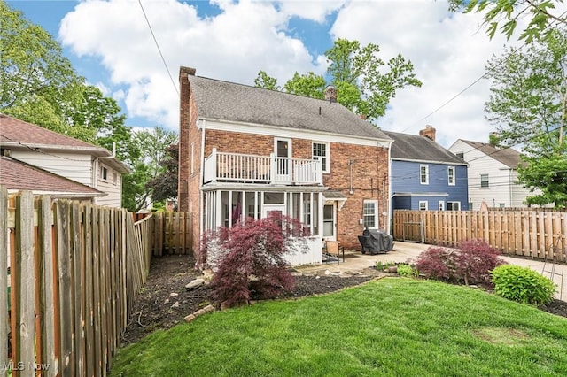 3945 Meadowbrook Blvd, University Heights, OH 44118 - rear view of house featuring a balcony, a chimney, a patio area, and brick siding