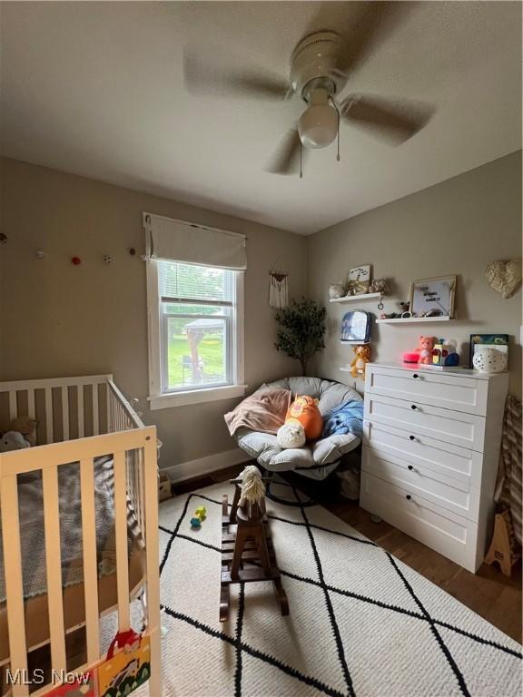 724 8th St, Struthers, OH 44471 - bedroom with ceiling fan and wood finished floors
