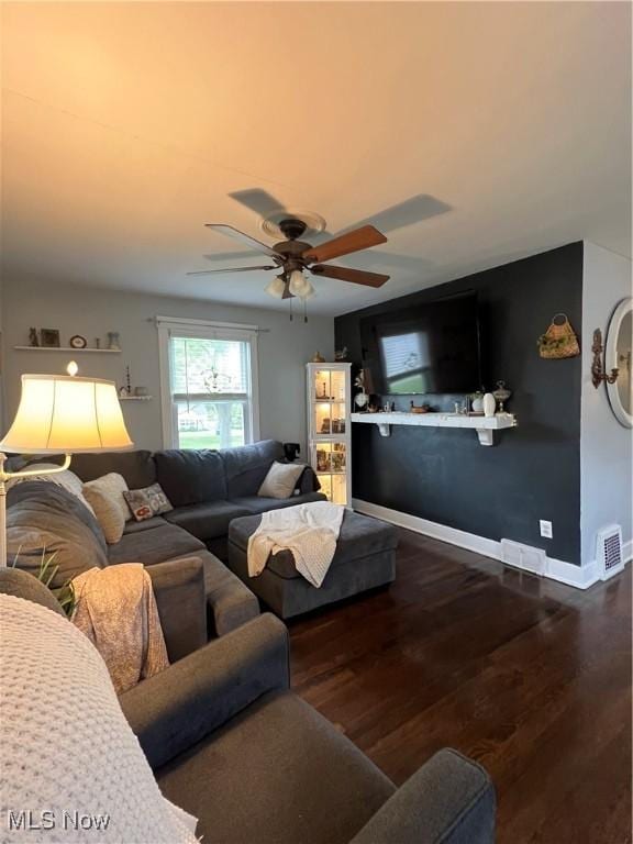 724 8th St, Struthers, OH 44471 - living room featuring a ceiling fan, dark wood finished floors, and baseboards