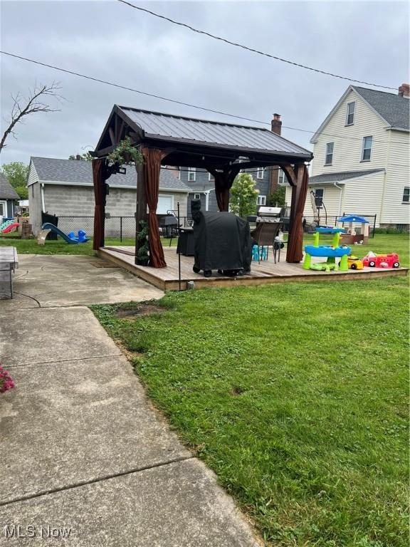 724 8th St, Struthers, OH 44471 - view of grassy yard with a gazebo and a deck