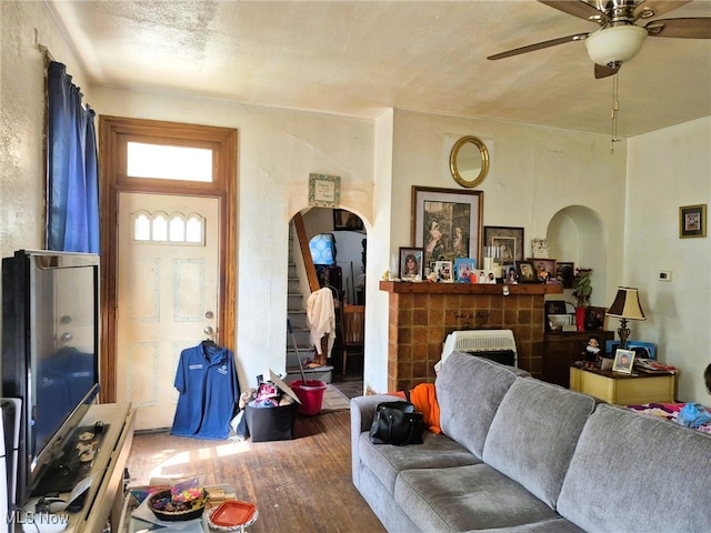 308 10th St, Wellsville, OH 43968 - living room featuring wood finished floors, ceiling fan, and arched walkways