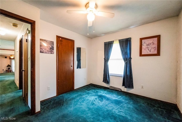 7544 Stoddard Hayes Rd, Farmdale, OH 44417 - unfurnished bedroom featuring carpet flooring and a ceiling fan