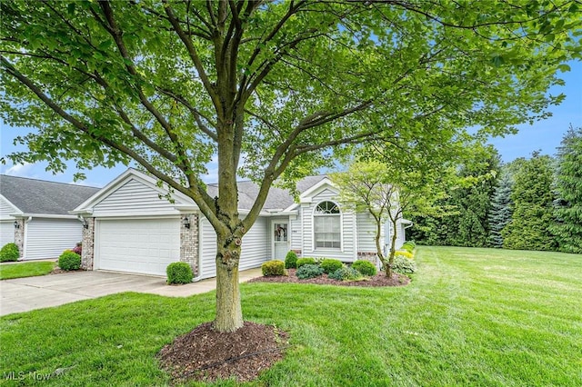 194 Lisa Ann Dr, Huron, OH 44839 - view of front of house with driveway, a garage, a front lawn, and brick siding