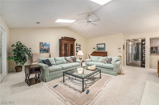 194 Lisa Ann Dr, Huron, OH 44839 - living area with a skylight, ceiling fan, lofted ceiling, baseboards, and light carpet