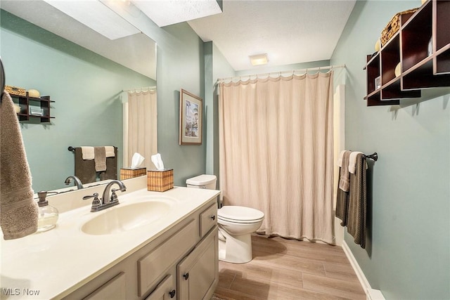 194 Lisa Ann Dr, Huron, OH 44839 - bathroom with toilet, wood finished floors, vanity, and curtained shower