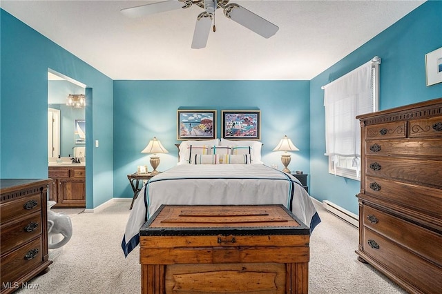 194 Lisa Ann Dr, Huron, OH 44839 - bedroom featuring a baseboard heating unit, carpet, baseboards, connected bathroom, and a ceiling fan