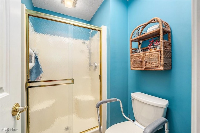 194 Lisa Ann Dr, Huron, OH 44839 - bathroom featuring a stall shower, toilet, and a textured ceiling