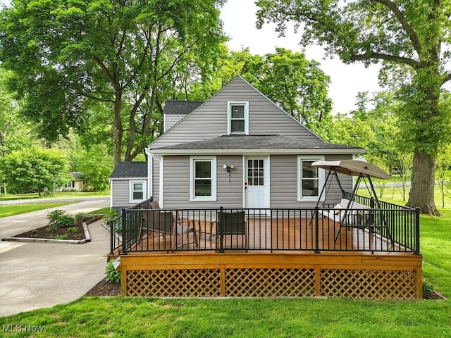 3136 Ellet Ave, Akron, OH 44312 - back of property with a deck, a lawn, and roof with shingles