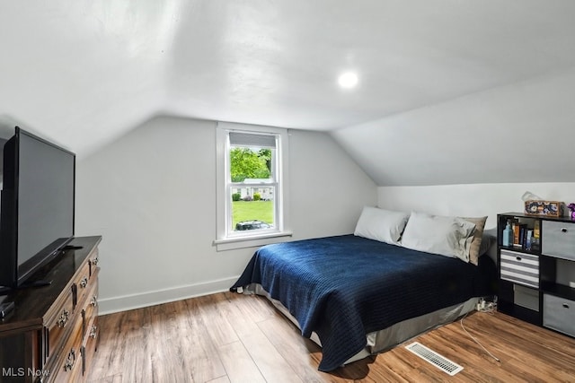 3136 Ellet Ave, Akron, OH 44312 - bedroom with wood finished floors, vaulted ceiling, and baseboards