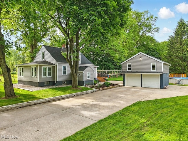 3136 Ellet Ave, Akron, OH 44312 - view of front of house featuring concrete driveway, a garage, and a front yard