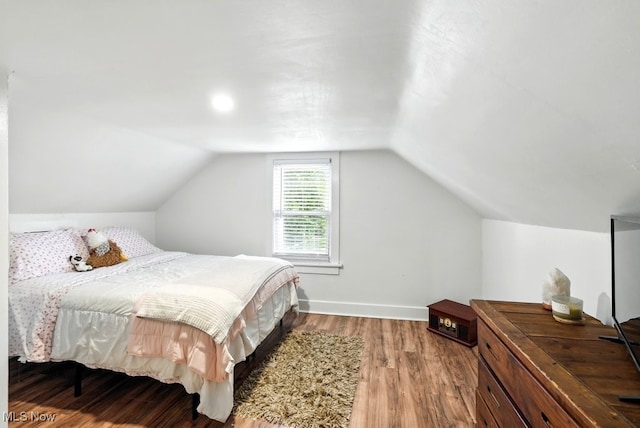 3136 Ellet Ave, Akron, OH 44312 - bedroom featuring wood finished floors, lofted ceiling, and baseboards