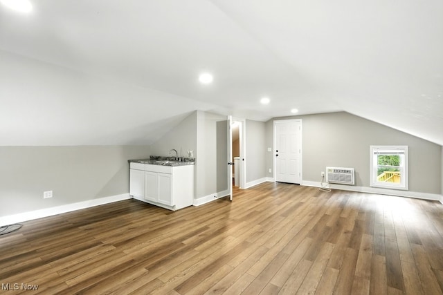 3136 Ellet Ave, Akron, OH 44312 - additional living space with vaulted ceiling, a wall mounted AC, wood finished floors, baseboards, and recessed lighting