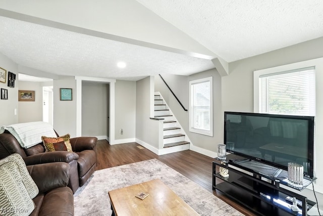 3136 Ellet Ave, Akron, OH 44312 - living area featuring a textured ceiling, dark wood-style floors, stairway, baseboards, and lofted ceiling