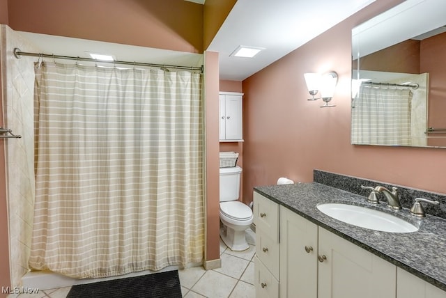 869 State Route 303, Streetsboro, OH 44241 - bathroom featuring toilet, tile patterned floors, and vanity