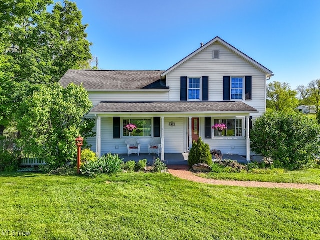 869 State Route 303, Streetsboro, OH 44241 - traditional-style house with a porch, a front lawn, and roof with shingles