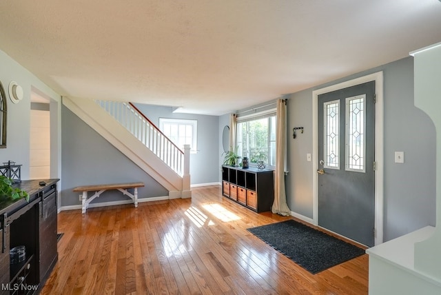 869 State Route 303, Streetsboro, OH 44241 - foyer with stairway, light wood-type flooring, and baseboards