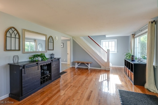 869 State Route 303, Streetsboro, OH 44241 - entrance foyer featuring stairway, light wood-style flooring, and baseboards