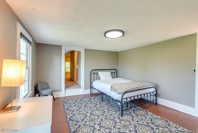 869 State Route 303, Streetsboro, OH 44241 - bedroom with wood finished floors, multiple windows, and baseboards