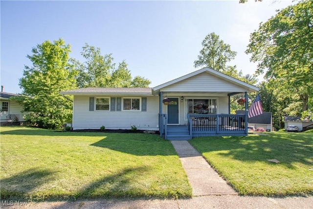 2116 Alden Ave NW, Massillon, OH 44647 - view of front of house featuring covered porch and a front lawn