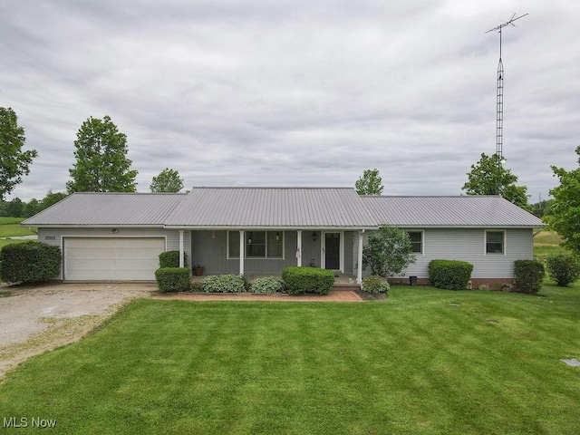 16000 Louisville St, Homeworth, OH 44634 - ranch-style house with metal roof, a garage, a front yard, and driveway