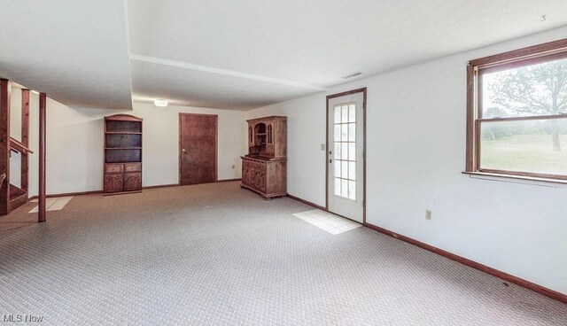 16000 Louisville St, Homeworth, OH 44634 - unfurnished room with light colored carpet, stairway, and baseboards