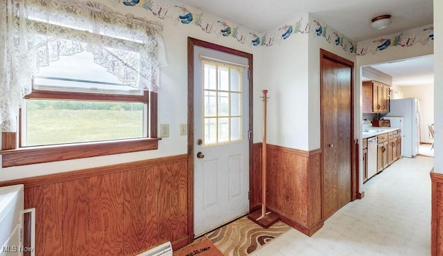 16000 Louisville St, Homeworth, OH 44634 - doorway to outside with a wainscoted wall and light floors