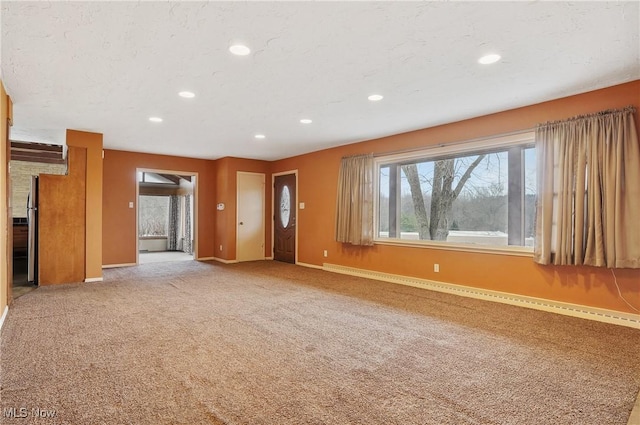 4017 Bellaire Ln, Peninsula, OH 44264 - unfurnished living room with baseboards, recessed lighting, and light colored carpet