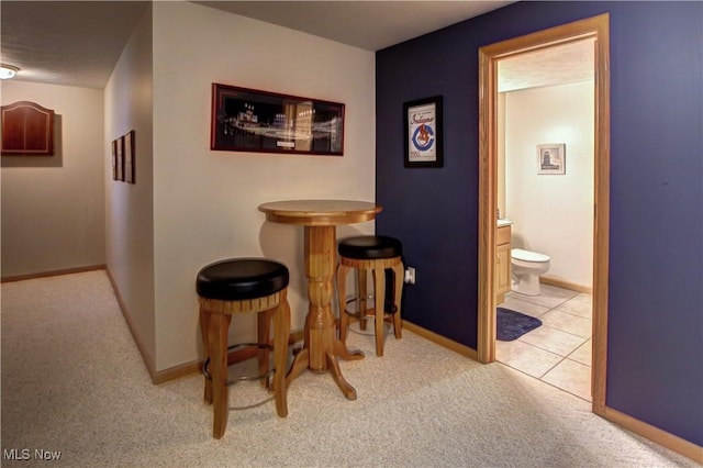 3936 Burgundy Bay Blvd W, Medina, OH 44256 - hallway featuring carpet flooring, baseboards, and tile patterned flooring