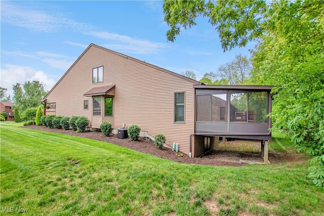 3936 Burgundy Bay Blvd W, Medina, OH 44256 - view of side of property with a sunroom and a lawn