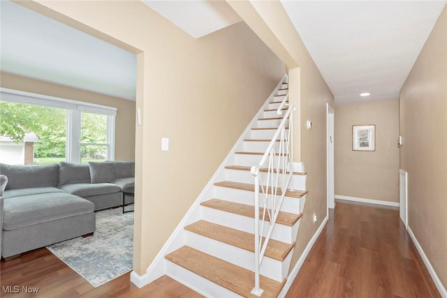 2381 Charney Rd, University Heights, OH 44118 - stairs with wood finished floors, baseboards, and recessed lighting