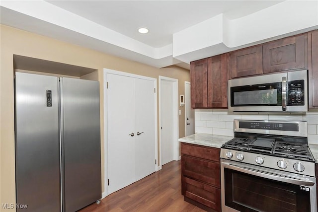 2381 Charney Rd, University Heights, OH 44118 - kitchen featuring stainless steel appliances, dark wood-style flooring, decorative backsplash, dark brown cabinetry, and recessed lighting