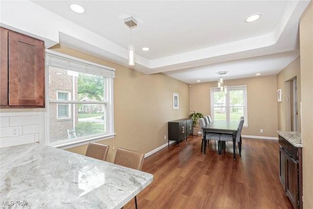 2381 Charney Rd, University Heights, OH 44118 - kitchen with dark wood finished floors, decorative light fixtures, baseboards, recessed lighting, and light stone countertops