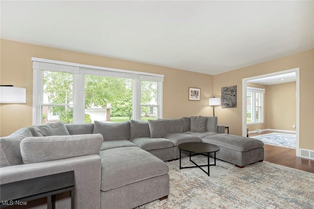 2381 Charney Rd, University Heights, OH 44118 - living area featuring wood finished floors, plenty of natural light, and baseboards