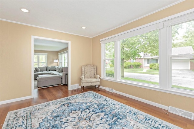 2381 Charney Rd, University Heights, OH 44118 - sitting room with ornamental molding, wood finished floors, baseboards, and recessed lighting