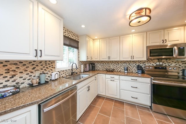 726 N Fork Way, Brunswick Hills, OH 44212 - kitchen with appliances with stainless steel finishes, a sink, tile patterned flooring, tasteful backsplash, and recessed lighting
