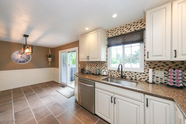 726 N Fork Way, Brunswick Hills, OH 44212 - kitchen with dishwasher, a sink, a wainscoted wall, tile patterned floors, and tasteful backsplash