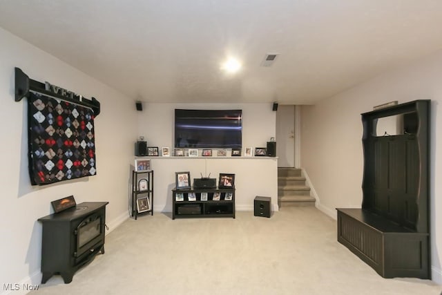 726 N Fork Way, Brunswick Hills, OH 44212 - living area featuring carpet, a wood stove, stairway, and baseboards