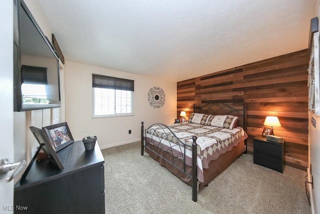 726 N Fork Way, Brunswick Hills, OH 44212 - bedroom with wood walls, an accent wall, light colored carpet, and baseboards