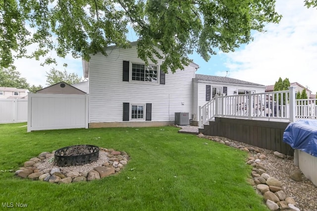 726 N Fork Way, Brunswick Hills, OH 44212 - rear view of property with an outdoor fire pit, a wooden deck, and central AC unit
