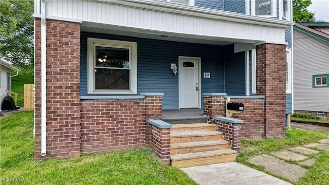 821 9th St SW, Massillon, OH 44647 - entrance to property with brick siding and covered porch