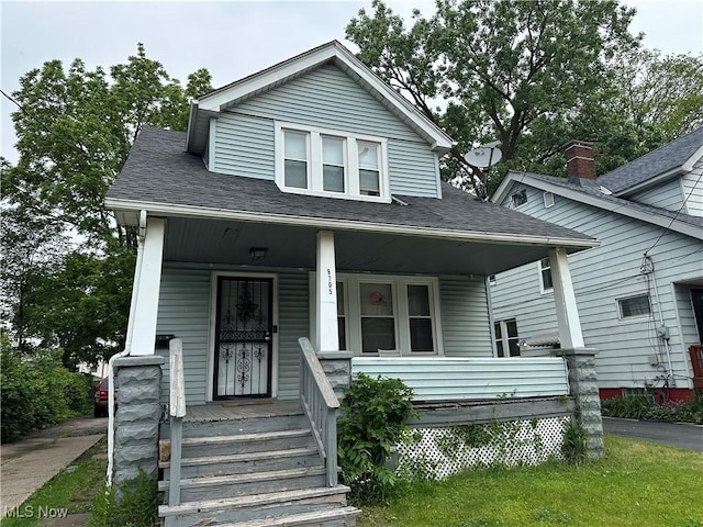 9705 Marah Ave, Cleveland, OH 44104 - bungalow-style home with covered porch and a shingled roof