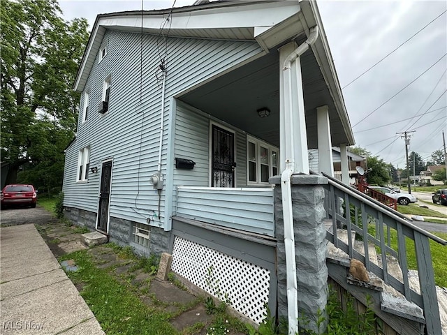 9705 Marah Ave, Cleveland, OH 44104 - view of side of home with covered porch