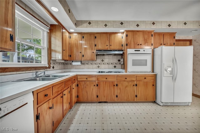 50 Luikart Dr, Euclid, OH 44123 - kitchen featuring white appliances, light floors, a sink, under cabinet range hood, and light countertops