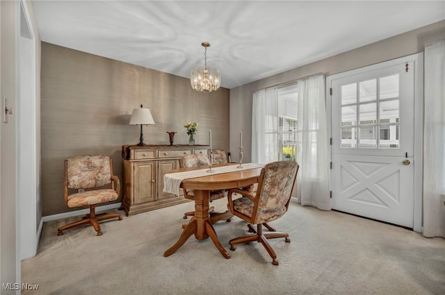 50 Luikart Dr, Euclid, OH 44123 - dining room with light carpet, a chandelier, and baseboards
