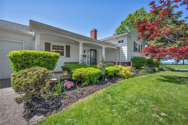 50 Luikart Dr, Euclid, OH 44123 - ranch-style house featuring a front yard, a chimney, and covered porch