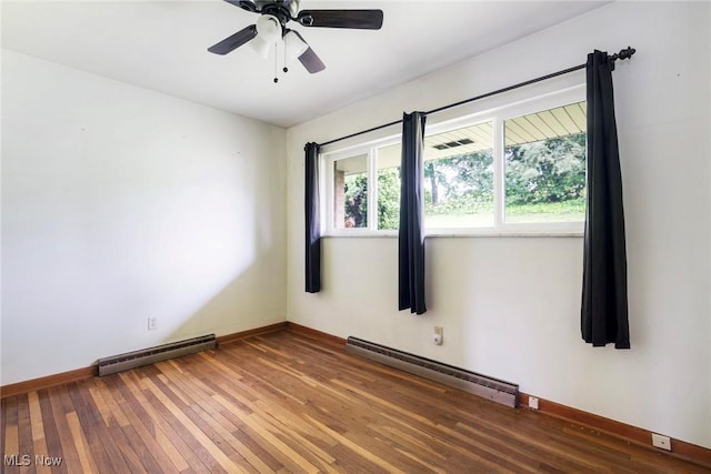 600 Elson St, East Liverpool, OH 43920 - empty room with baseboard heating, baseboards, and hardwood / wood-style flooring