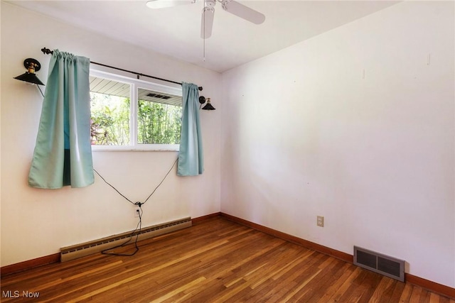 600 Elson St, East Liverpool, OH 43920 - spare room featuring baseboard heating, wood finished floors, baseboards, and ceiling fan