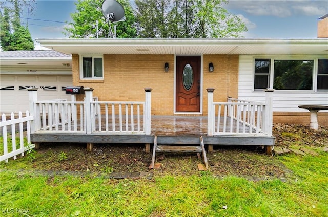 600 Elson St, East Liverpool, OH 43920 - view of exterior entry with a garage and brick siding