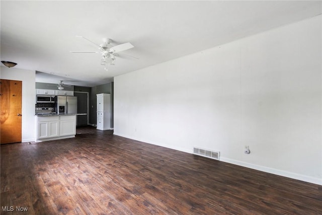 600 Elson St, East Liverpool, OH 43920 - unfurnished living room featuring ceiling fan, baseboards, and dark wood finished floors
