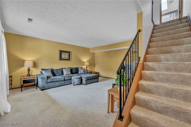 808 Doty Dr, Wadsworth, OH 44281 - carpeted living room with stairs, baseboards, and a textured ceiling
